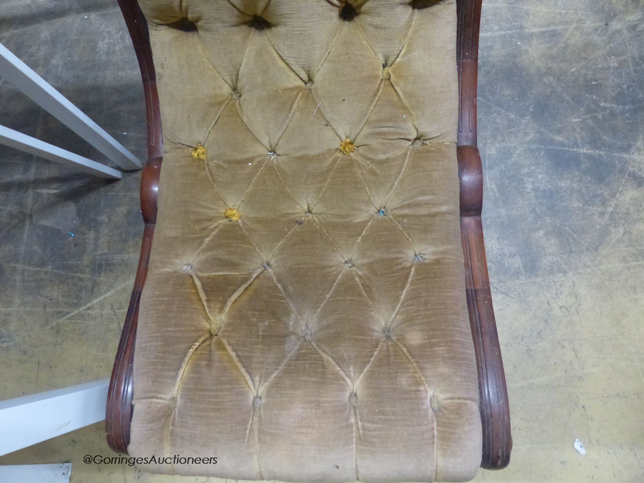 A Victorian mahogany slipper chair.